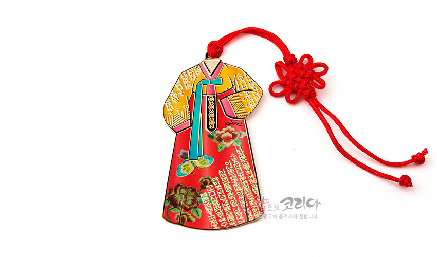[텍스트: shop of Korea] 금속 재질 한복 모양 책갈피, 칠보 기법의 노랑·빨강 바탕과 꽃문양, 한글 문양 장식, 붉은 전통 매듭끈 포인트 디자인
