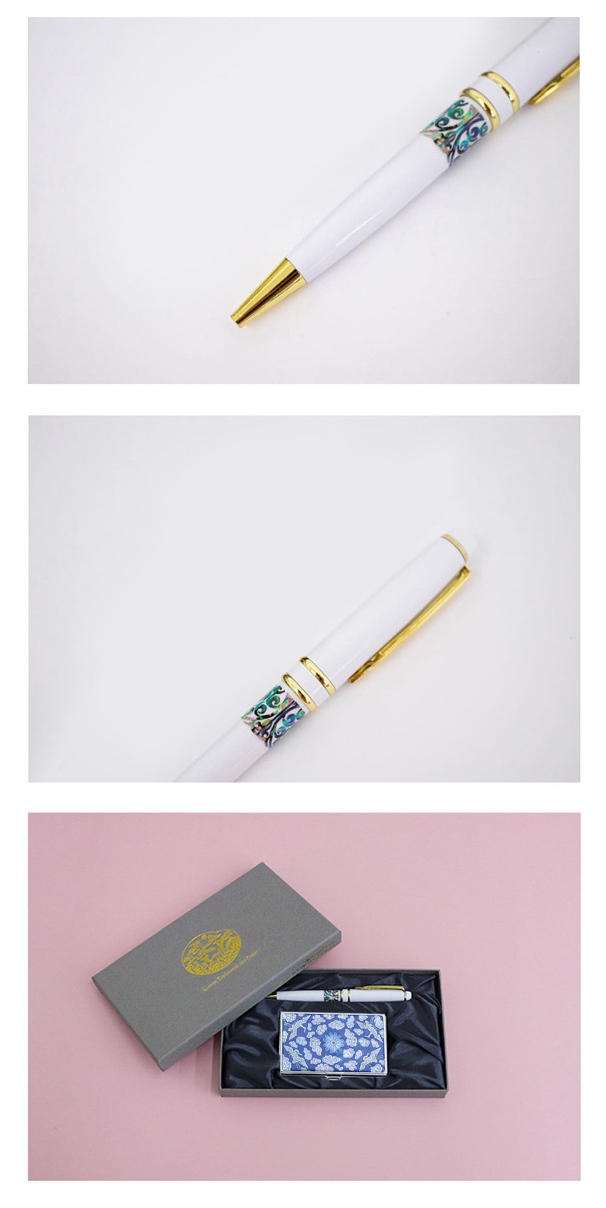 [텍스트: 없음] 흰색 바탕에 금색 금속 장식과 자개 상감 당초문 띠가 둘린 볼펜과 청화색 운학문 금속 명함케이스 세트 이미지 묘사