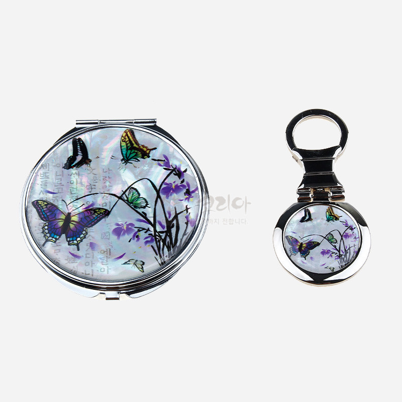 자개 상감 기법으로 표현된 흰 바탕에 난초와 나비 문양, 금속 테두리와 은은한 보랏빛 색채가 조화를 이룬 손거울 2종 세트.