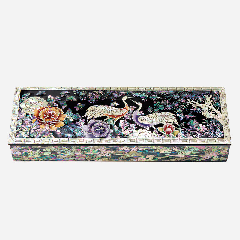 자개 상감과 옻칠 기법으로 표현된 송학과 모란, 국화 문양이 돋보이는 다채로운 색상의 장방형 필함.