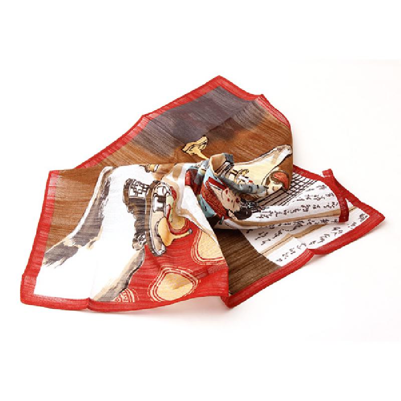 한지 질감 표현의 천 소재에 꼬마신랑 민속화와 한글 글귀가 인쇄된 손수건, 붉은색 테두리 마감이 특징인 제품.