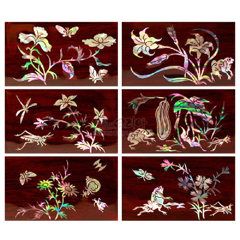 짙은 옻칠 바탕 위 자개 상감으로 원추리와 꽃, 나비·개구리 등 자연 문양을 섬세하게 장식한 육각 함.