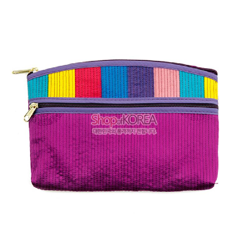 보라색 누비 원단에 노랑·빨강·청록·분홍 등 색동 패치를 더한 직사각형 티슈 지갑, 금속 지퍼 장식 특징.